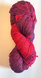 Raspberry rayon metallic yarn with broken thread